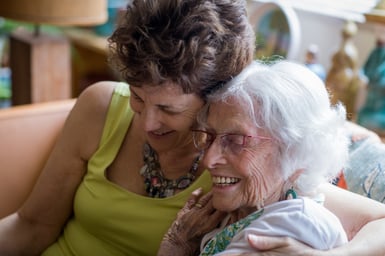 Caring for elderly parents: Family caregiver and their aging parent embrace