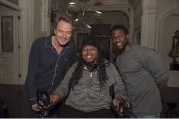 Bryan Cranston, Eric LeGrand, and Kevin Hart pose for a picture.