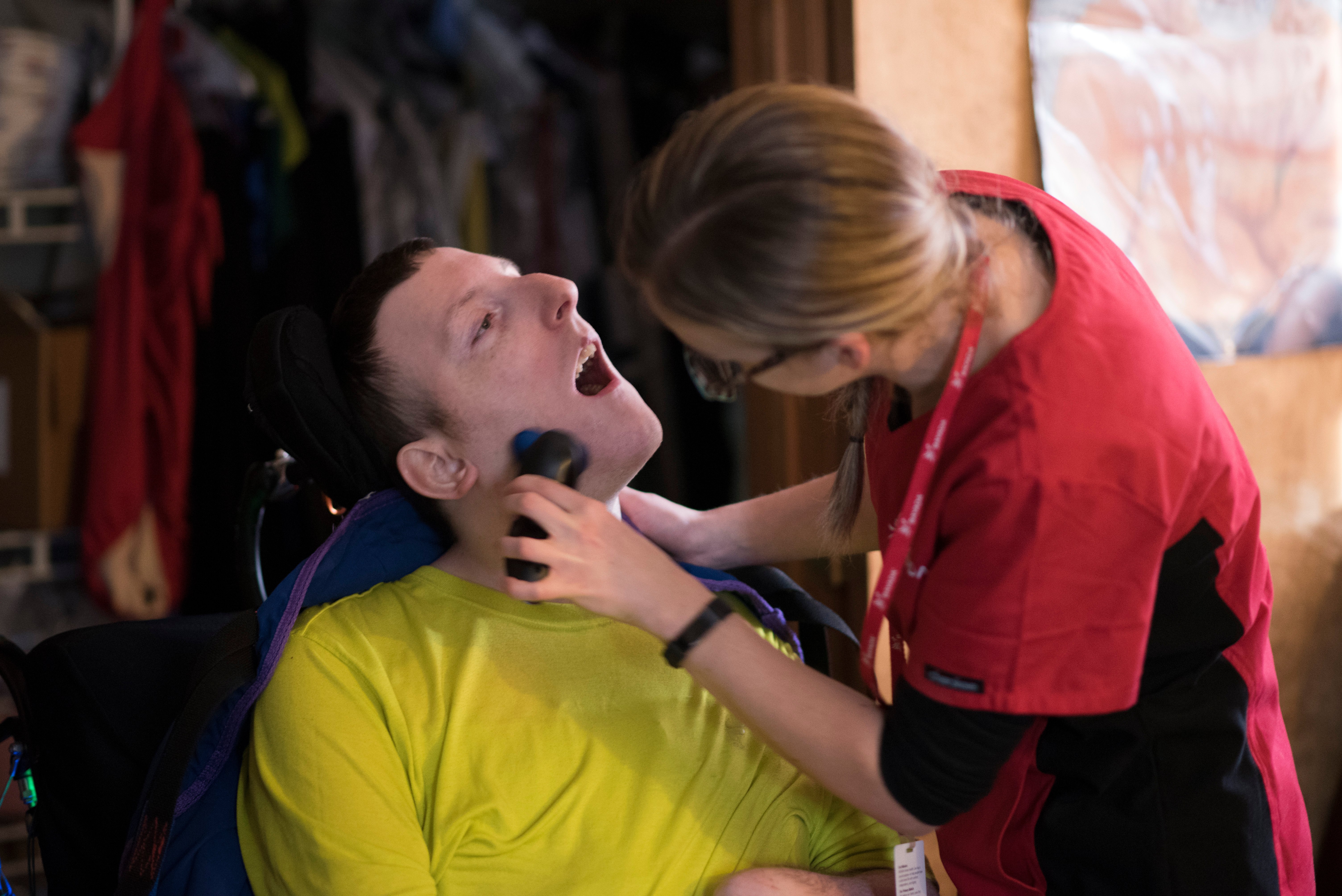 Home health aide duties: photo of a HHA shaving a client